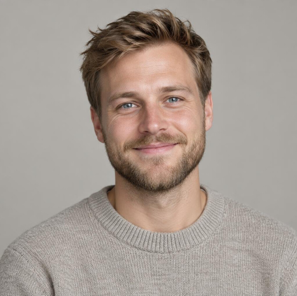 Studio portrait of a young Danish male photographer smiling