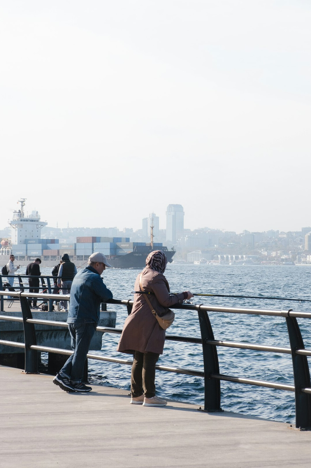 Candid portrait of an elderly Danish fisherman on a harbor pier