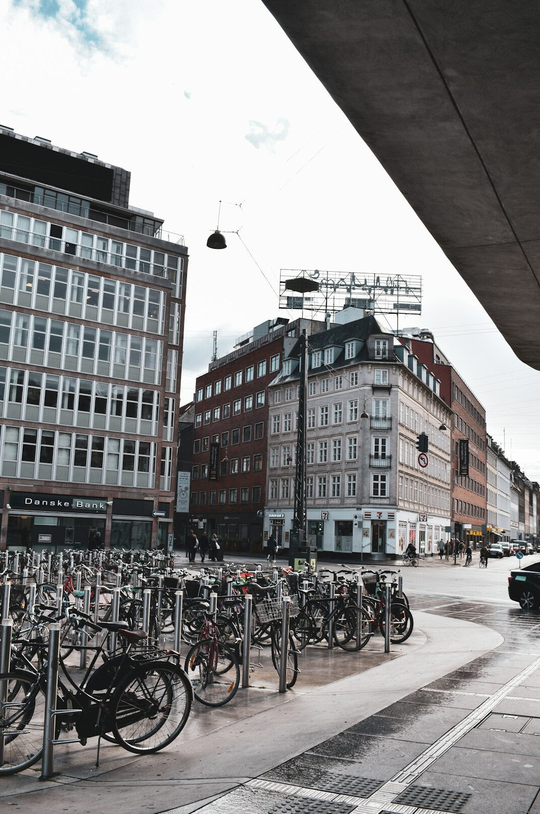 Row of parked bicycles along a Copenhagen street