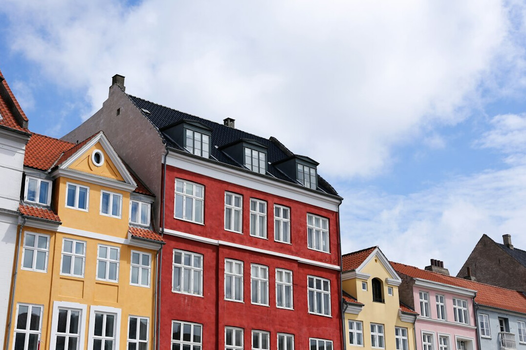 Colorful historic townhouses along the Nyhavn harbor in Copenhagen