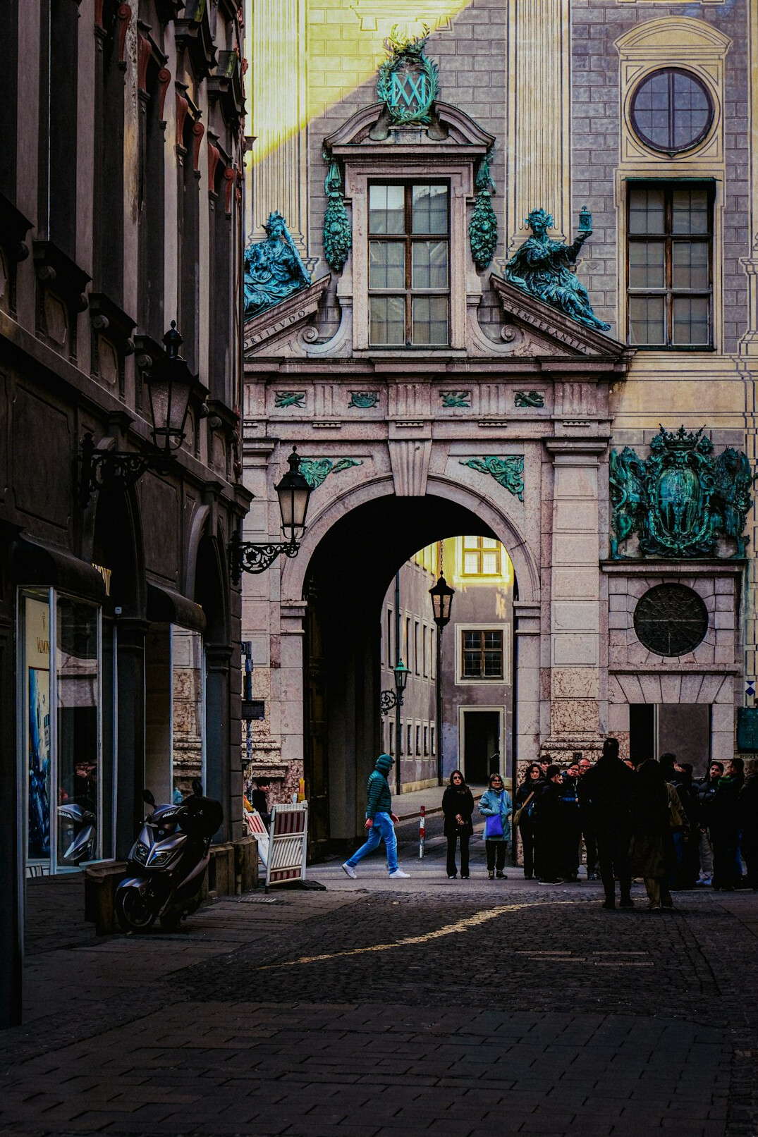 person walking on cobblestone street