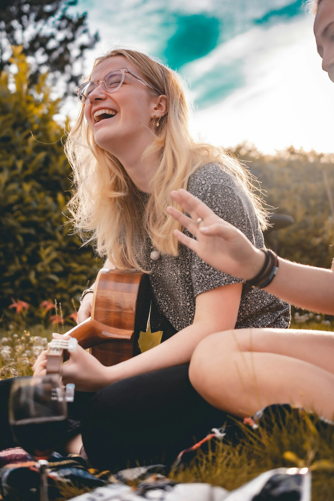 friends laughing at picnic